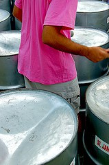 Young man playing steel drums